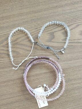 Stackable Pink and Clear Beaded Bracelet And Two 4 Ocean Bracelets.